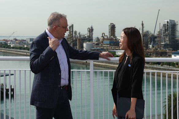 Anthony Albanese is shown an overview of Jurong Island operations by JTC Corp assistant chief Christine Wong. The prime minister continues his petrol diplomacy to Brunei on Tuesday.