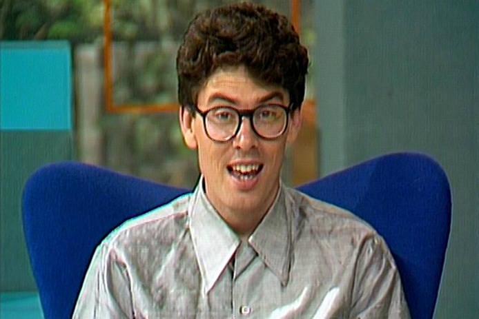 A photo of a young man with glassed from the late 1980s. 