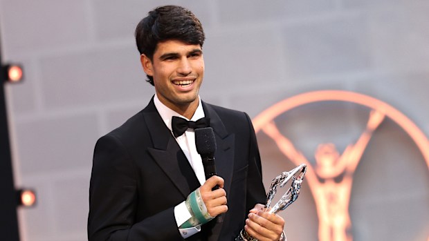Carlos Alcaraz accepts the Laureus World Sportsman of the Year award, with a cast on his wrist.