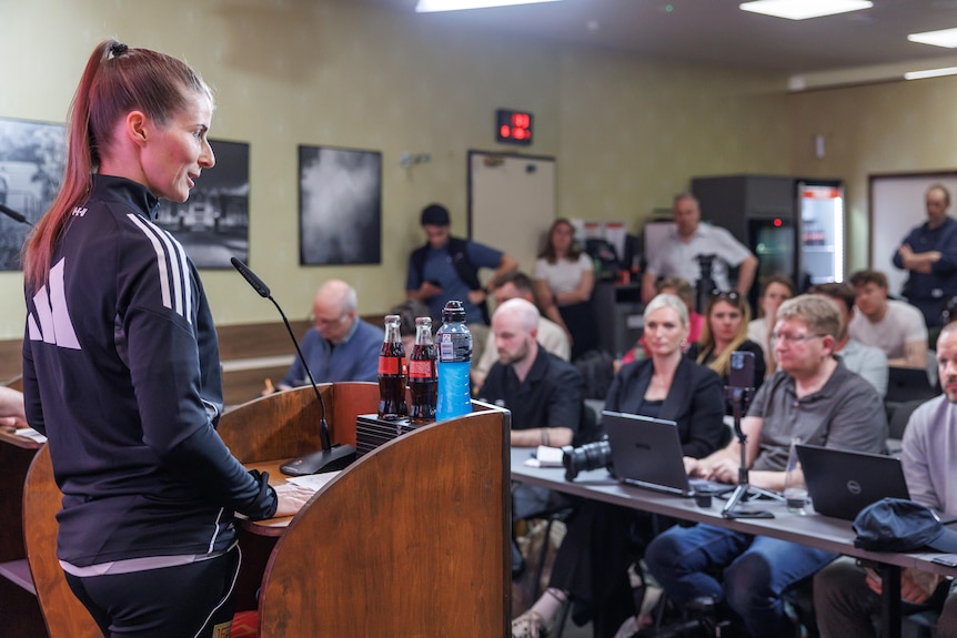 Marie Louise Eta talks at a press conference