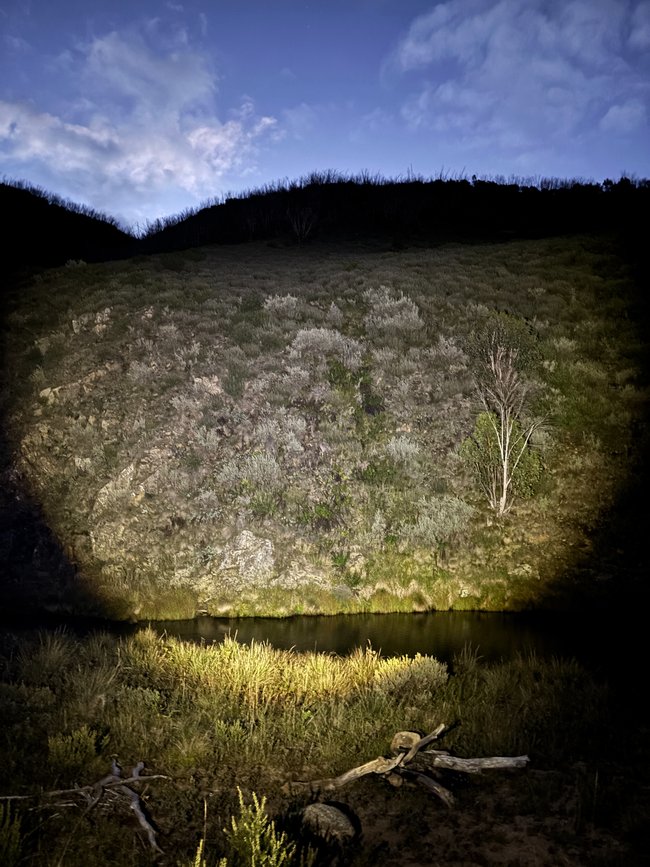 The H8R effortlessly lighting up a cliff face next to the Tumut River in Kosciuszko.