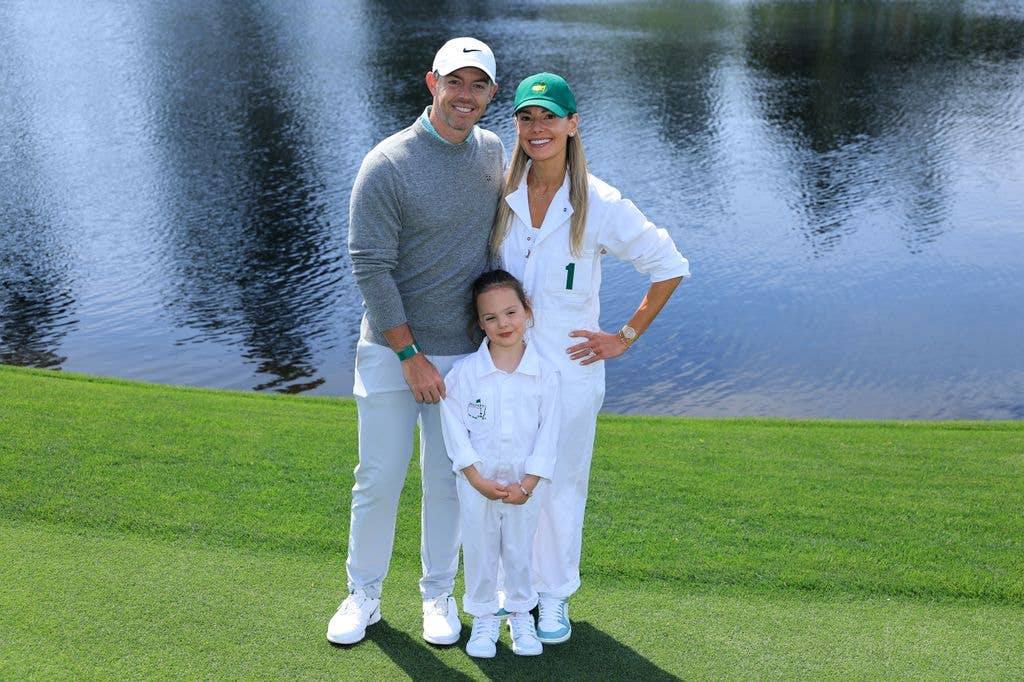 Rory McIlroy of Northern Ireland poses with his Daughter Poppy and Wife Erica during the Par Three Contest prior to the 2026 Masters Tournament at Augusta National Golf Club on April 8, 2026 in Augusta, Georgia.