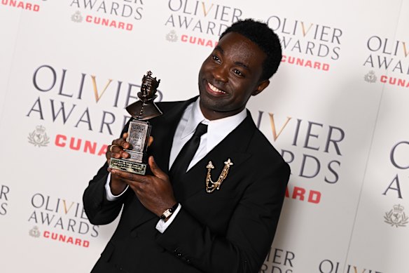 Paapa Essiedu poses with the best actor in a supporting role award for All My Sons.