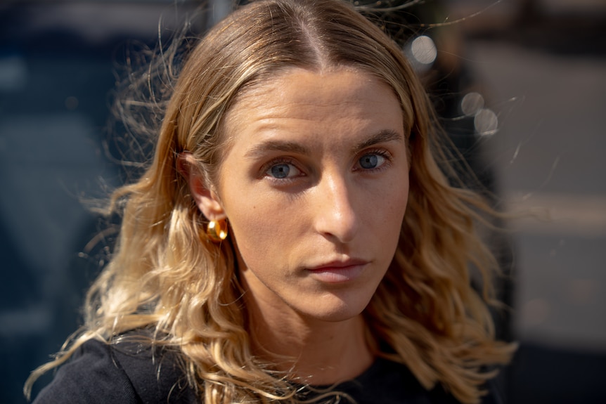close-up of a woman's face who looks serious