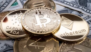 A selection of different cryptocurrency coins piled together over US dollar banknotes. (file image)