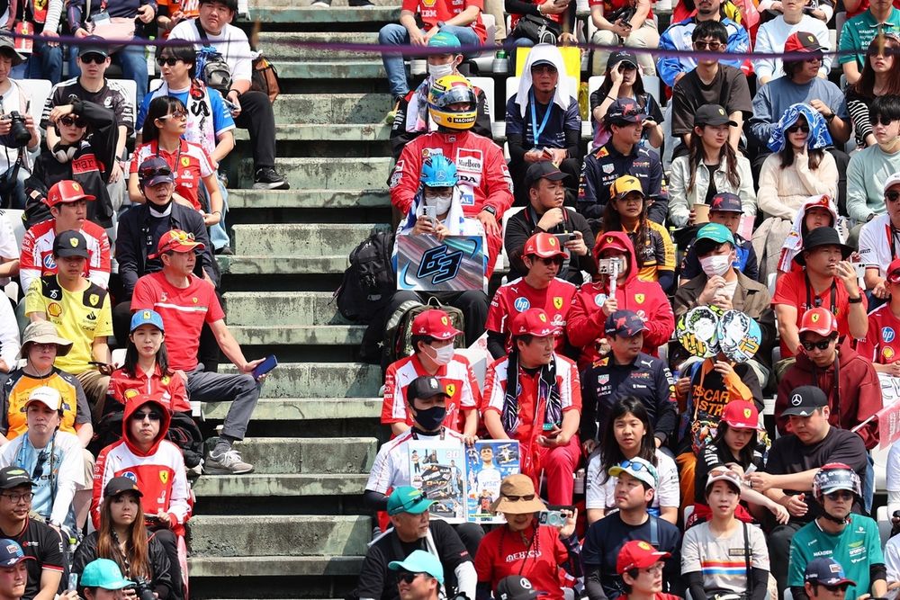 Ferrari fans in a grandstand.