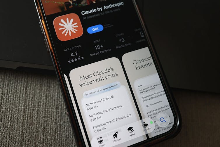 The Claude AI app is seen in the app store on a smartphone with the promotional text 'Meet Claude's voice with yours.'