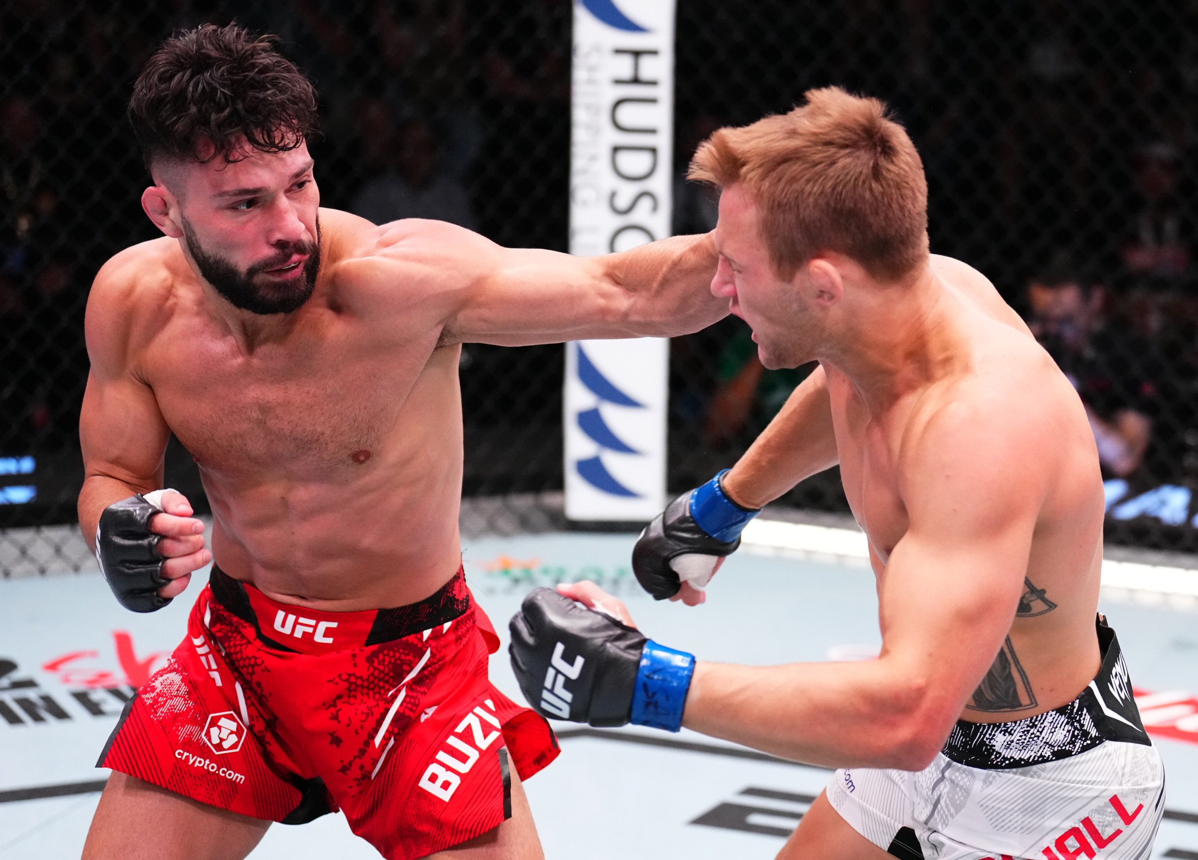LAS VEGAS, NEVADA - AUGUST 24: (L-R) Dennis Buzukja punches Francis Marshall in a featherweight fight during the UFC Fight Night event at UFC APEX on August 24, 2024 in Las Vegas, Nevada. (Photo by Chris Unger/Zuffa LLC)