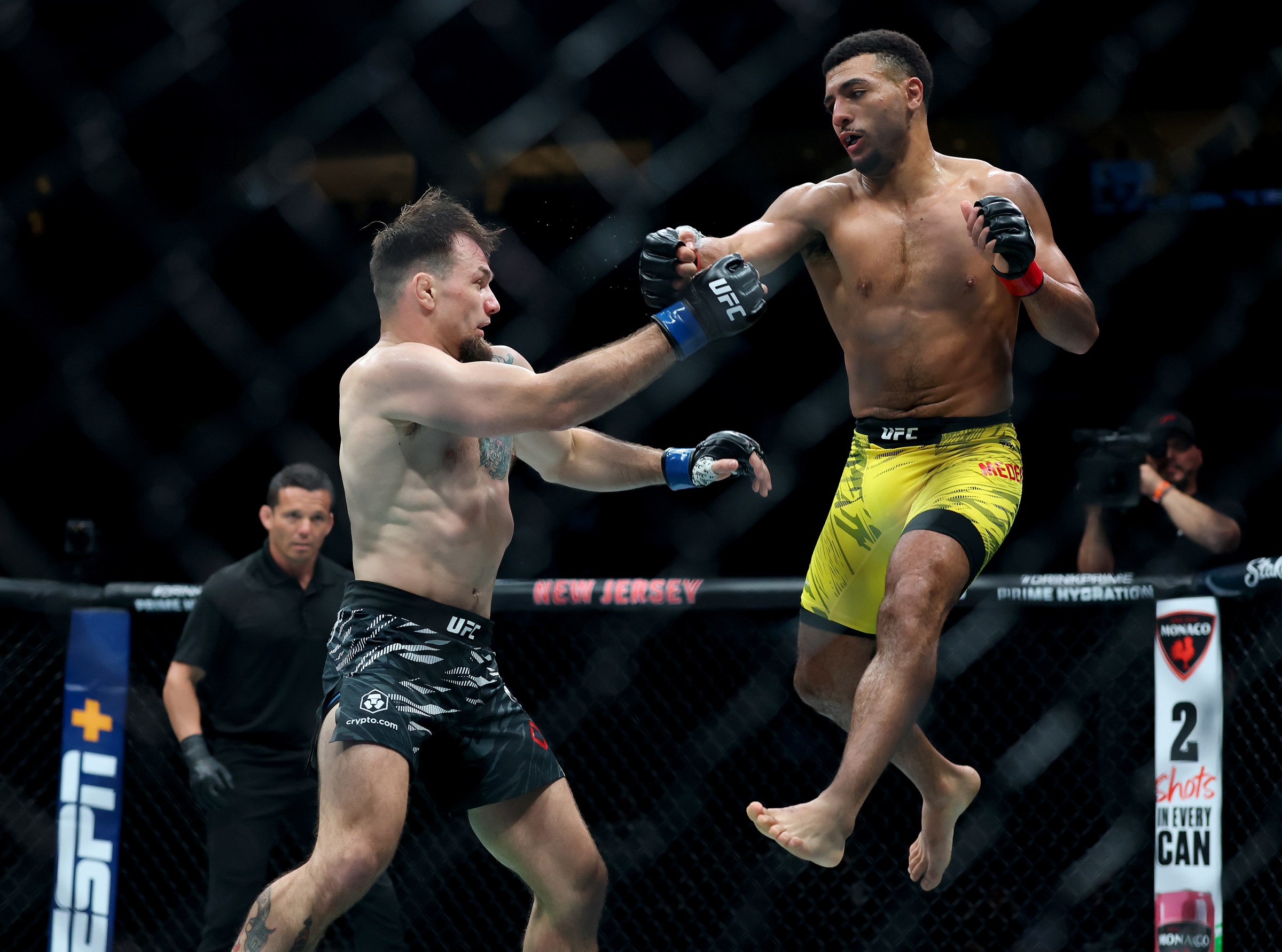 NEWARK, NEW JERSEY - JUNE 07: MarQuel Mederos of the United States leaps in the lightweight bout against Mark Choinski of the United States during UFC 316 at the Prudential Center on June 07, 2025 in Newark, New Jersey. (Photo by Elsa/Getty Images)