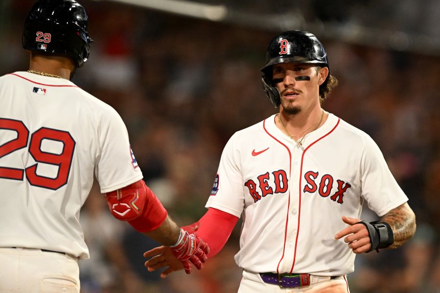 Duran celebrates a run with Abraham Toro during a game against Colorado last season.