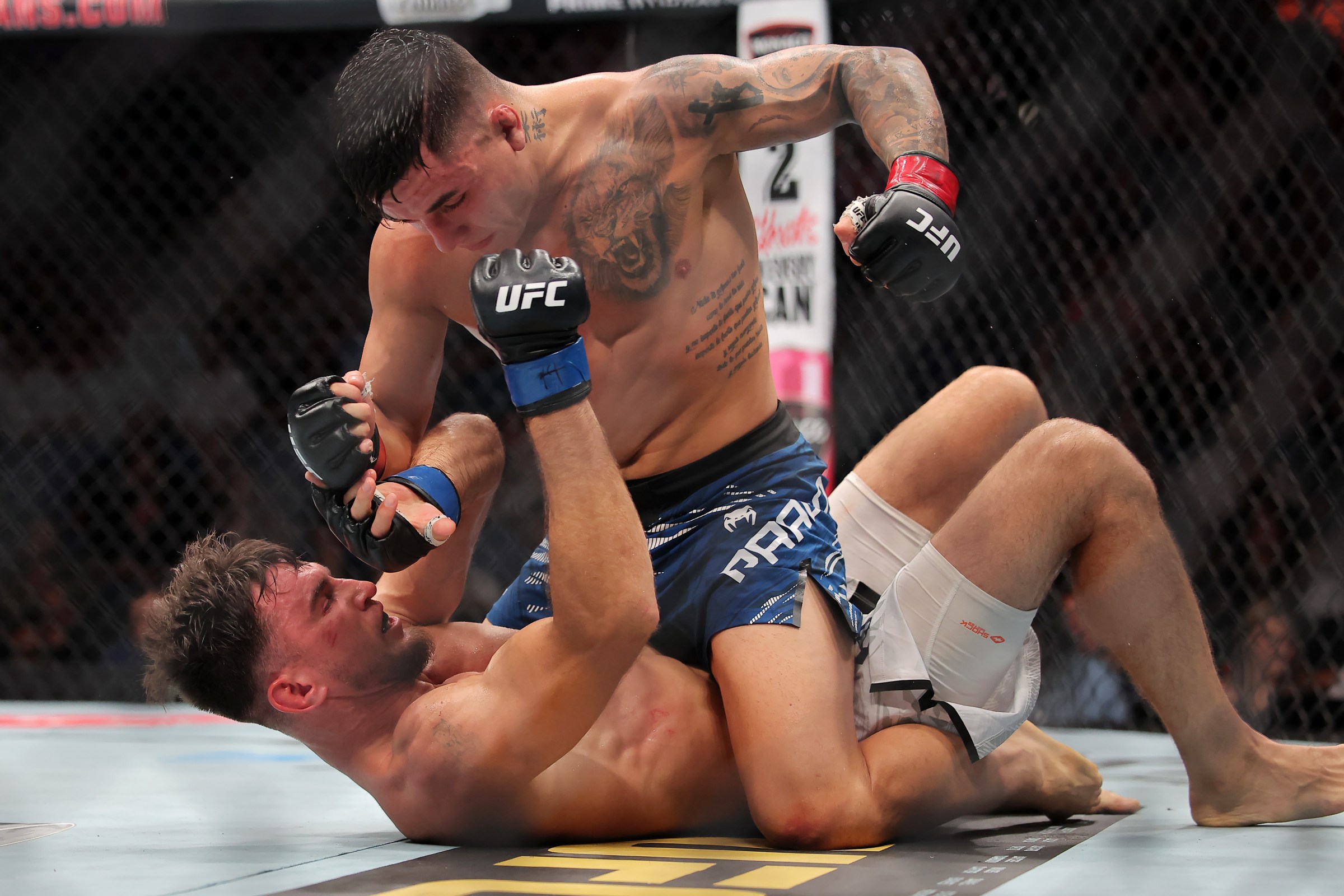 NEW ORLEANS, LOUISIANA - JULY 19: Francisco Prado of Argentina strikes Nikolay Veretennikov of Kazakhstan on the mat during their welterweight bout during UFC 318: Holloway vs Poirier 3 at the Smoothie King Center on July 19, 2025 in New Orleans, Louisiana. (Photo by Jonathan Bachman/Getty Images)