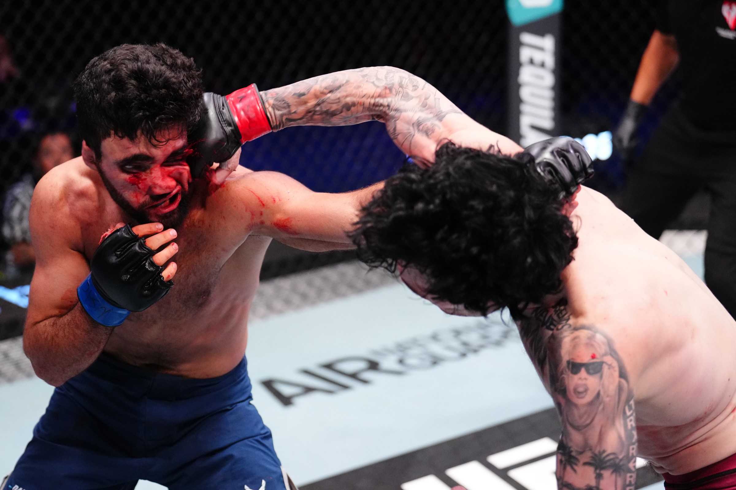 LAS VEGAS, NEVADA - SEPTEMBER 02: Tommy McMillen punches David Mgoyan of Russia in a featherweight fight during Dana White’s Contender Series season nine, week four at UFC APEX on September 02, 2025 in Las Vegas, Nevada. (Photo by Chris Unger/Zuffa LLC)