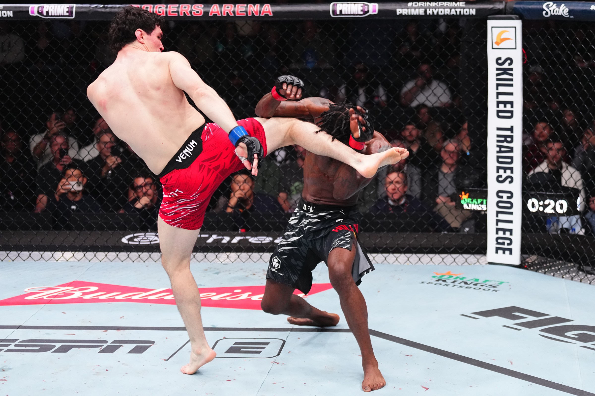 VANCOUVER, BRITISH COLUMBIA - OCTOBER 18: (L-R) Mike Malott kicks Kevin Holland in a welterweight fight during the UFC Fight Night event at Rogers Arena on October 18, 2025 in Vancouver, British Columbia. (Photo by Jeff Bottari/Zuffa LLC)