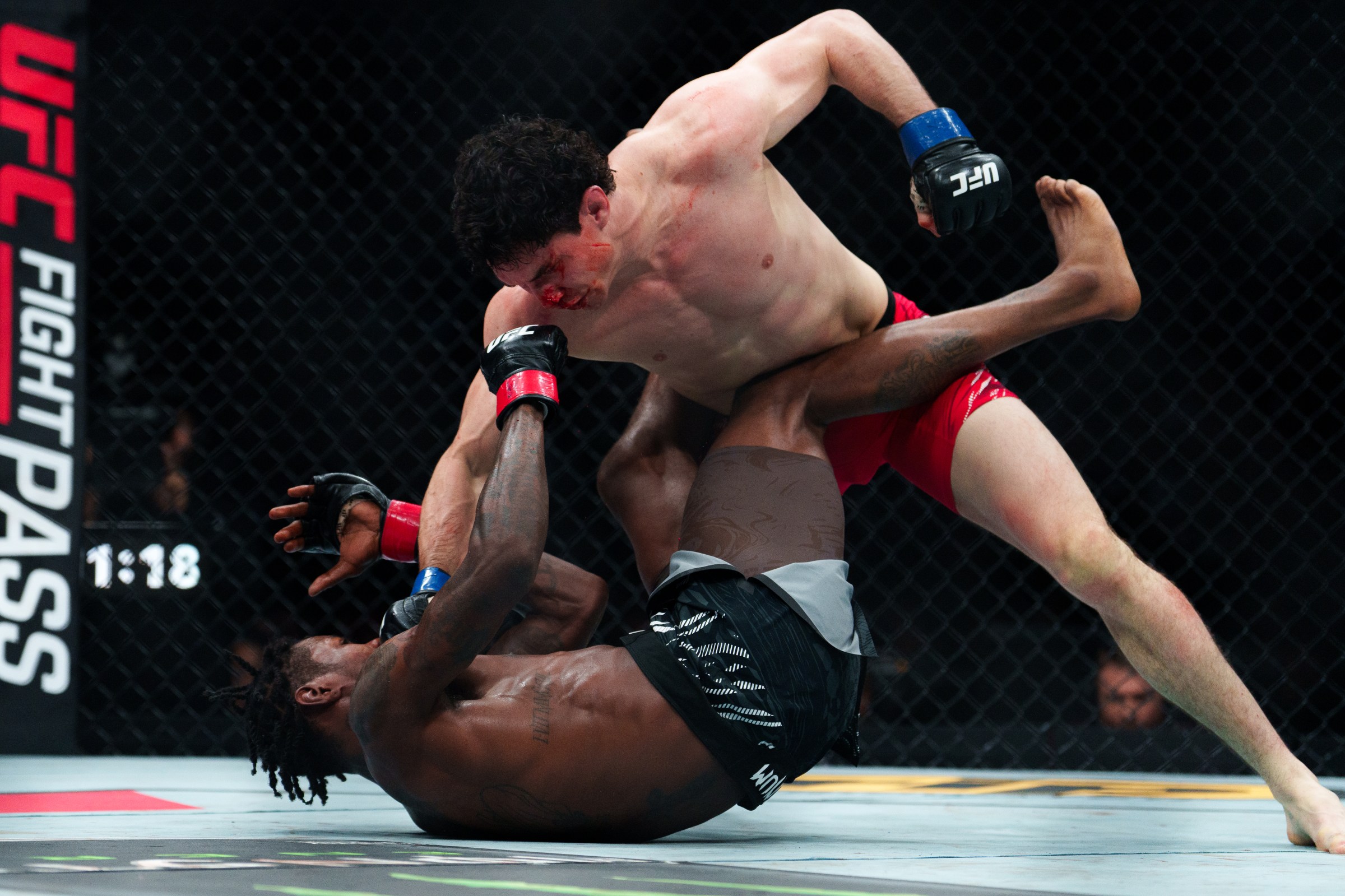 VANCOUVER, CANADA - OCTOBER 18: (top) Mike Malott attempts to strike Kevin Holland during the UFC Fight Night at Rogers Arena on October 18, 2025 in Vancouver, Canada. (Photo by Jordan Jones/Getty Images)