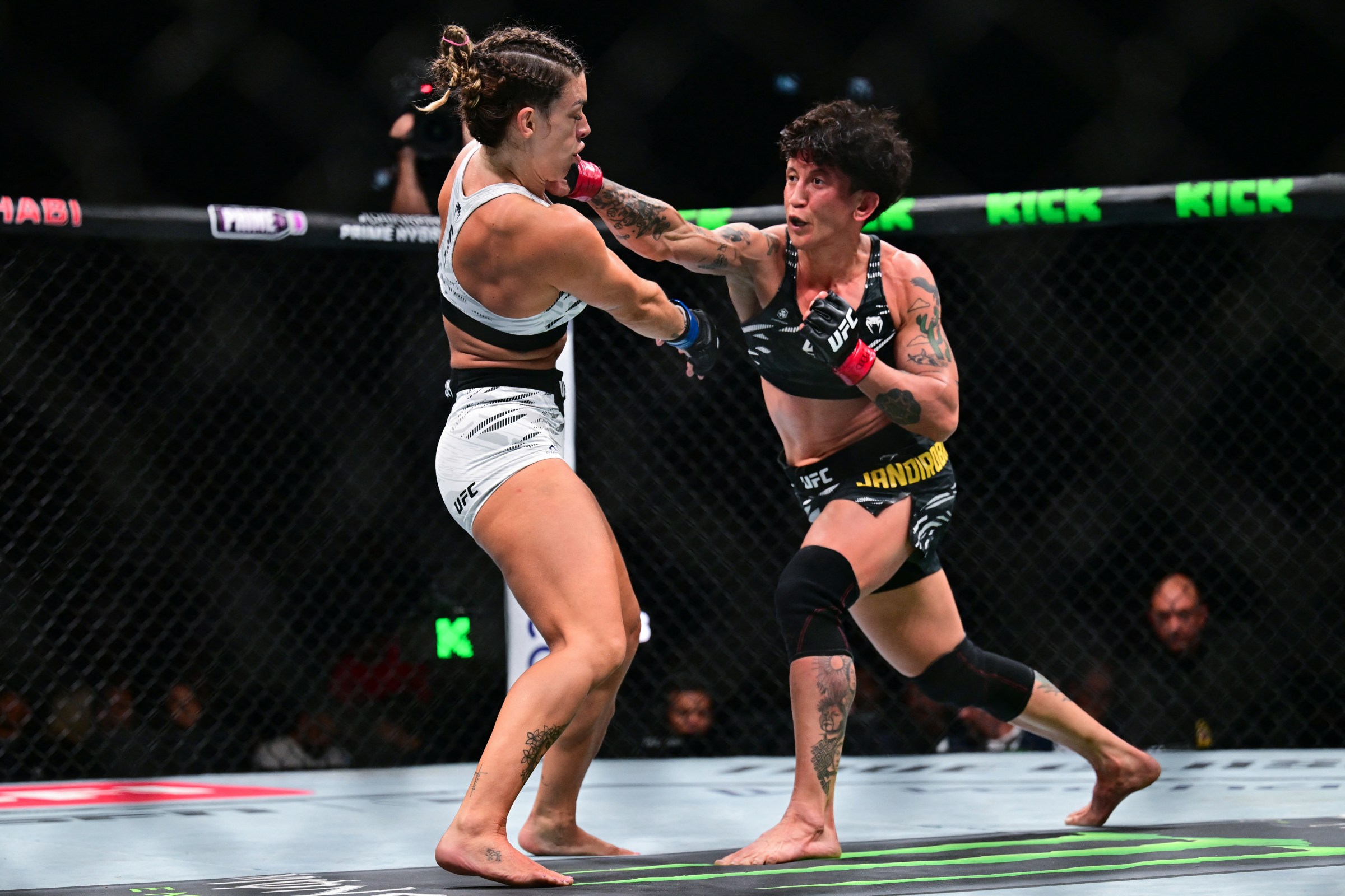 Brazilian-American Mackenzie Dern (R) fights Brazil’s Virna Jandiroba during their strawweight bout at UFC 321 at Etihad Arena in Abu Dhabi on October 25, 2025. (Photo by Giuseppe CACACE / AFP) (Photo by GIUSEPPE CACACE/AFP via Getty Images)