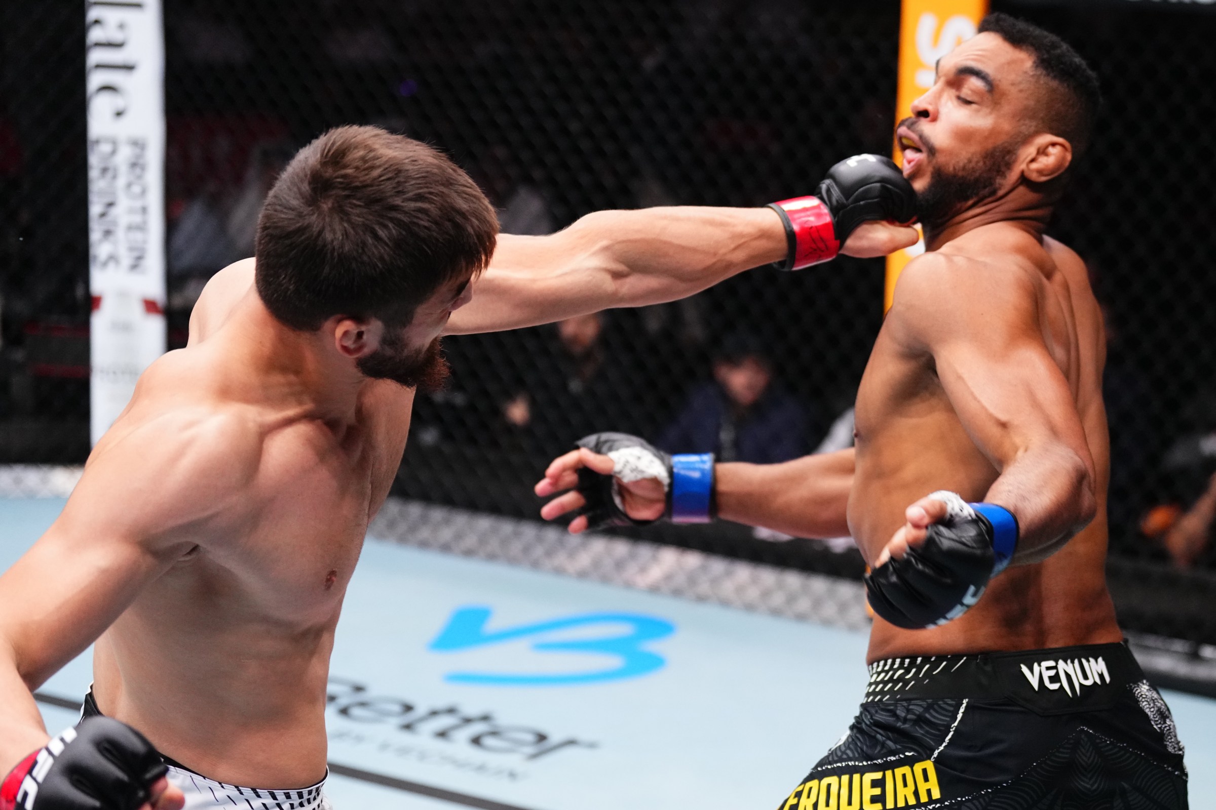 DOHA, QATAR - NOVEMBER 22: (L-R) Abdul Rakhman Yakhyaev of Russia punches Rafael Cerquiera of Brazil in a light heavyweight fight during the UFC Fight Night event at ABHA Arena on November 22, 2025 in Doha, Qatar. (Photo by Jeff Bottari/Zuffa LLC)
