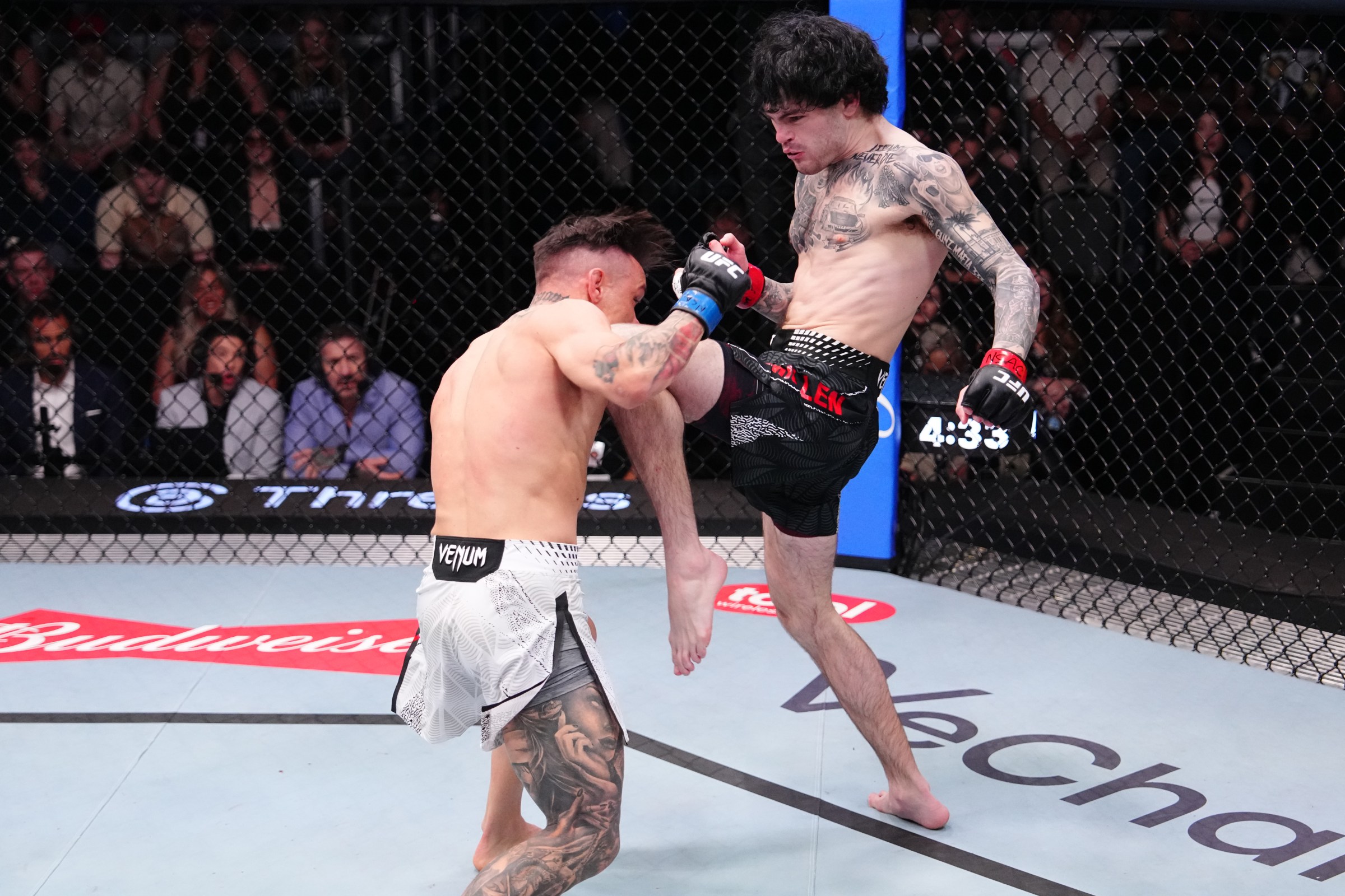LAS VEGAS, NEVADA - APRIL 04: (R-L) Tommy McMillen knees Manolo Zecchini of Italy in a featherweight fight during the UFC Fight Night event at Meta APEX on April 04, 2026 in Las Vegas, Nevada. (Photo by Jeff Bottari/Zuffa LLC)