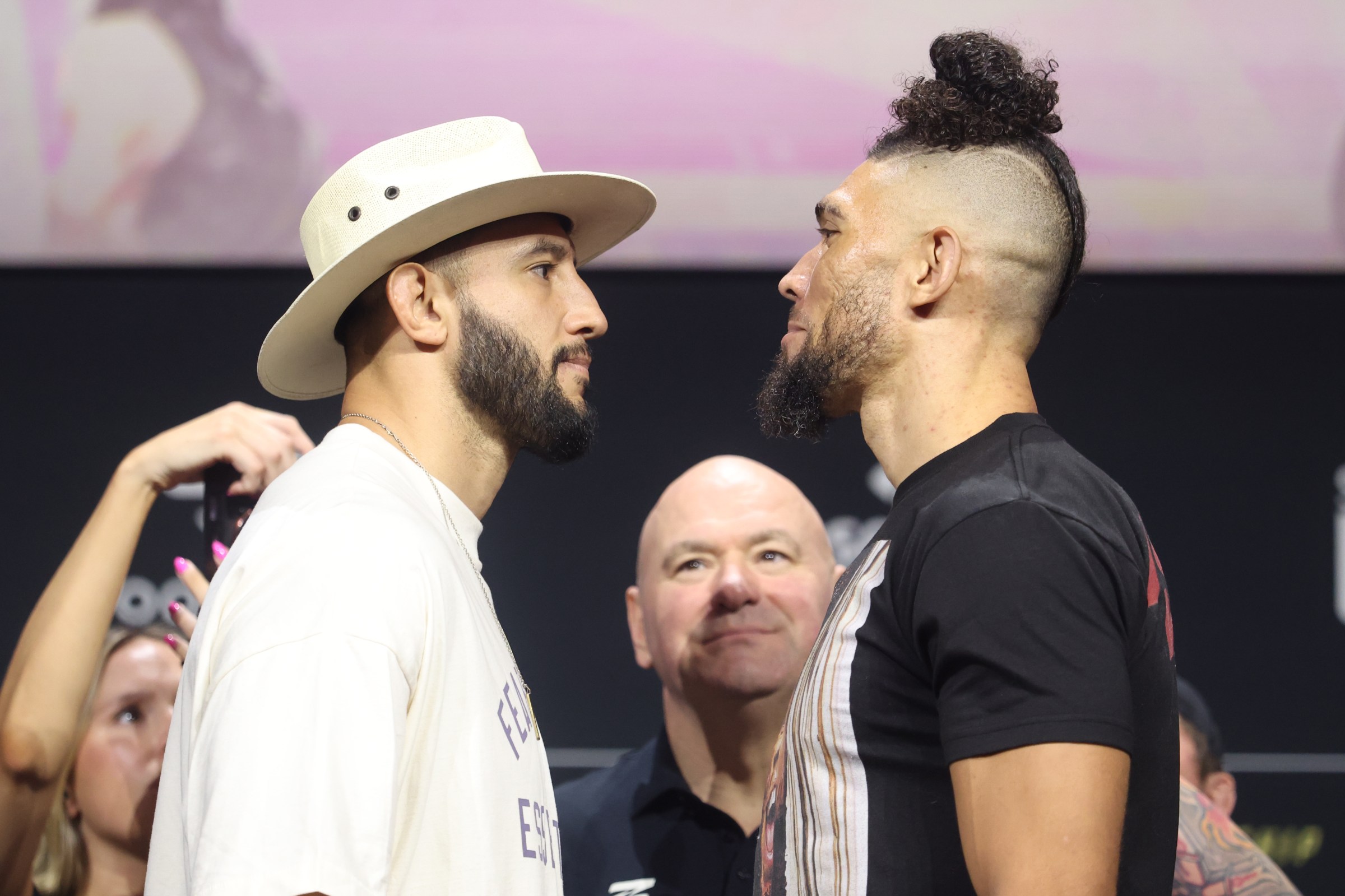 MIAMI, FLORIDA - APRIL 09: (L-R) Opponents Dominick Reyes and Johnny Walker of Brazil face off during the UFC 327 press conference at Kaseya Center on April 09, 2026 in Miami, Florida. (Photo by Ed Mulholland/Zuffa LLC)