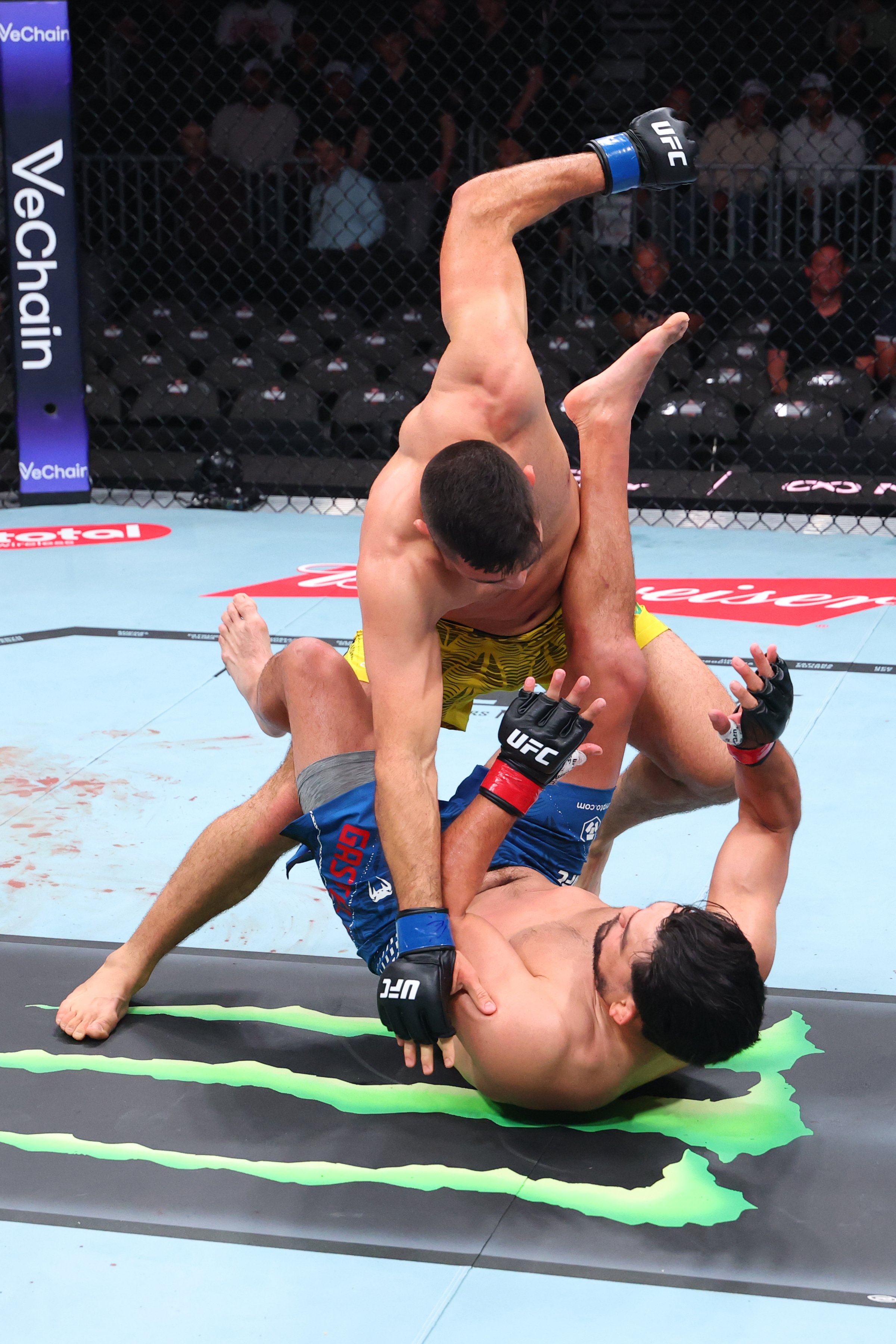 MIAMI, FLORIDA - APRIL 11: Vicente Luque punches Kelvin Gastelum in a middleweight fight during the UFC 327 event at Kaseya Center on April 11, 2026 in Miami, Florida. (Photo by Ed Mulholland/Zuffa LLC)