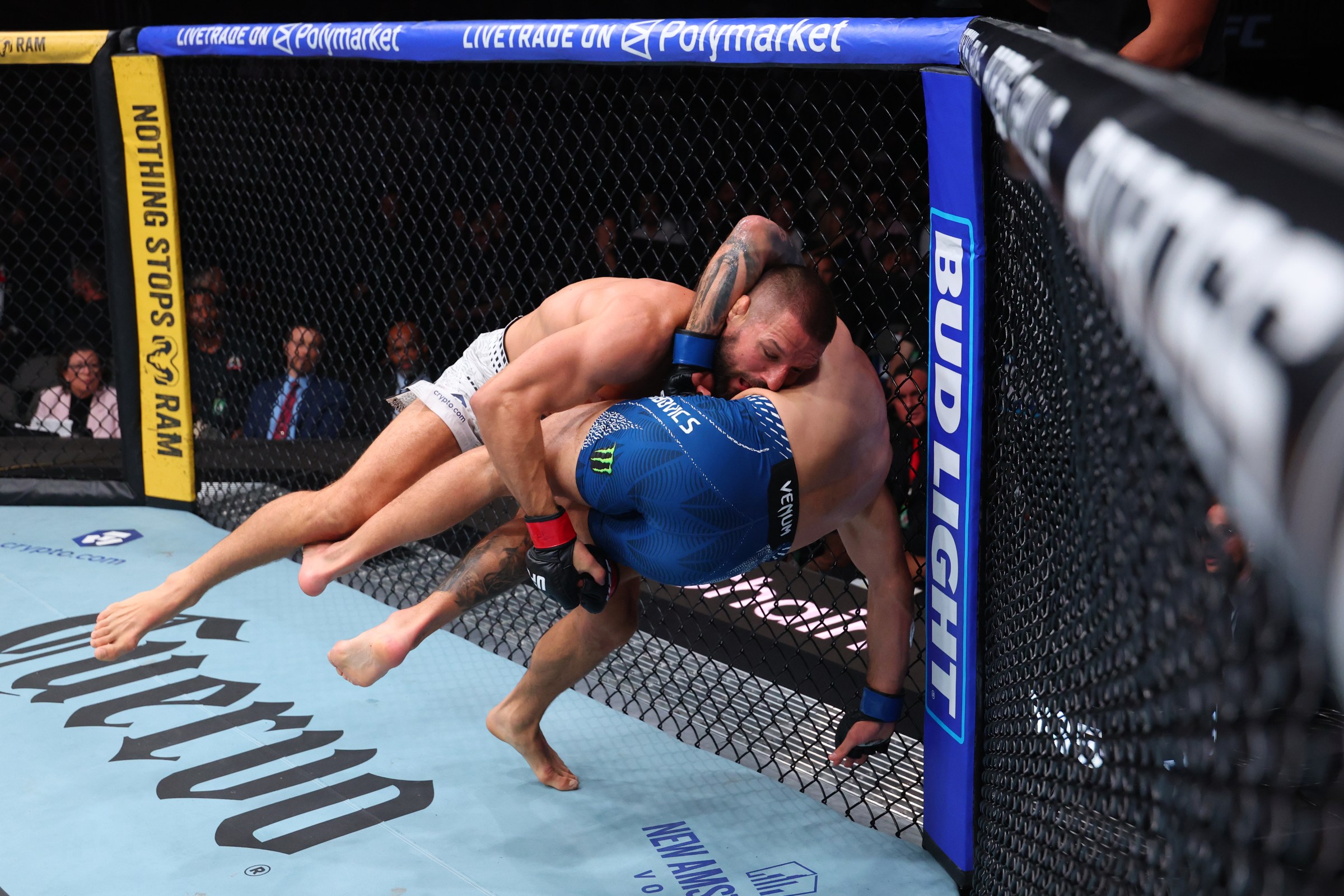 MIAMI, FLORIDA - APRIL 11: (L-R) Mateusz Gamrot of Poland takes down Esteban Ribovics of Argentina in a lightweight fight during the UFC 327 event at Kaseya Center on April 11, 2026 in Miami, Florida. (Photo by Ed Mulholland/Zuffa LLC)