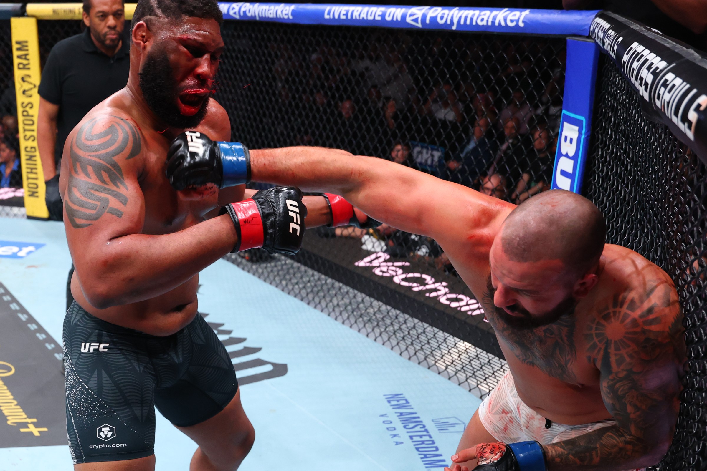 MIAMI, FLORIDA - APRIL 11: (R-L) Josh Hokit punches Curtis Blaydes in a heavyweight fight during the UFC 327 event at Kaseya Center on April 11, 2026 in Miami, Florida. (Photo by Ed Mulholland/Zuffa LLC)