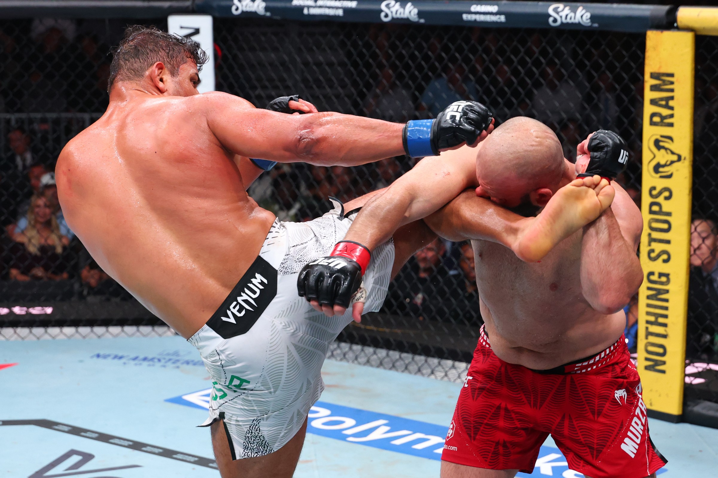 MIAMI, FLORIDA - APRIL 11: Paulo Costa of Brazil kicks Azamat Murzakanov of Russia in a light heavyweight fight during the UFC 327 event at Kaseya Center on April 11, 2026 in Miami, Florida. (Photo by Ed Mulholland/Zuffa LLC)