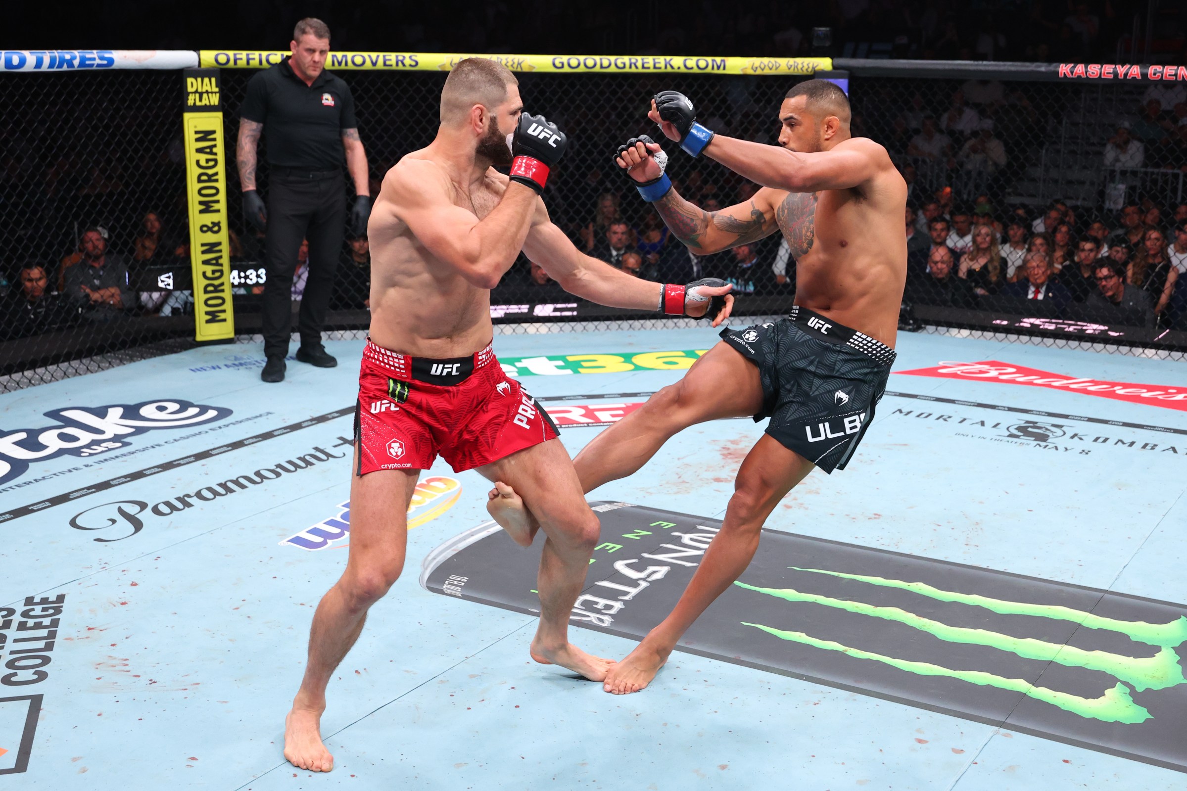 MIAMI, FLORIDA - APRIL 11: (R-L) Carlos Ulberg of New Zealand kicks Jiri Prochazka of the Czech Republic in the UFC light heavyweight championship fight during the UFC 327 event at Kaseya Center on April 11, 2026 in Miami, Florida. (Photo by Ed Mulholland/Zuffa LLC)
