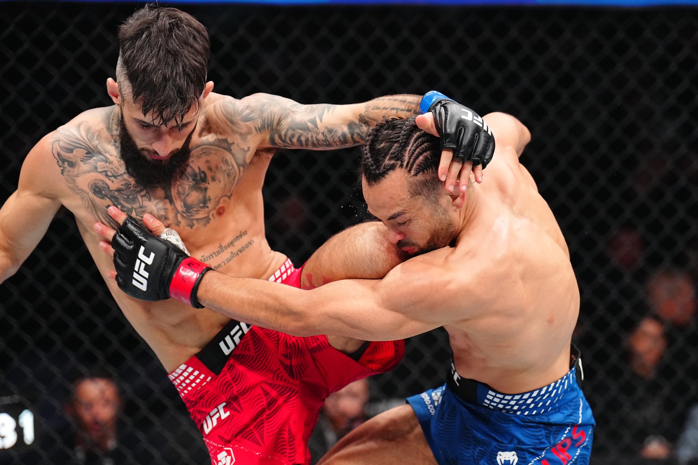 WINNIPEG, MANITOBA - APRIL 18: (L-R) Charles Jourdain of Canada knees Kyler Phillips in a bantamweight fight during the UFC Fight Night event at Canada Life Centre on April 18, 2026 in Winnipeg, Manitoba. (Photo by Chris Unger/Zuffa LLC)
