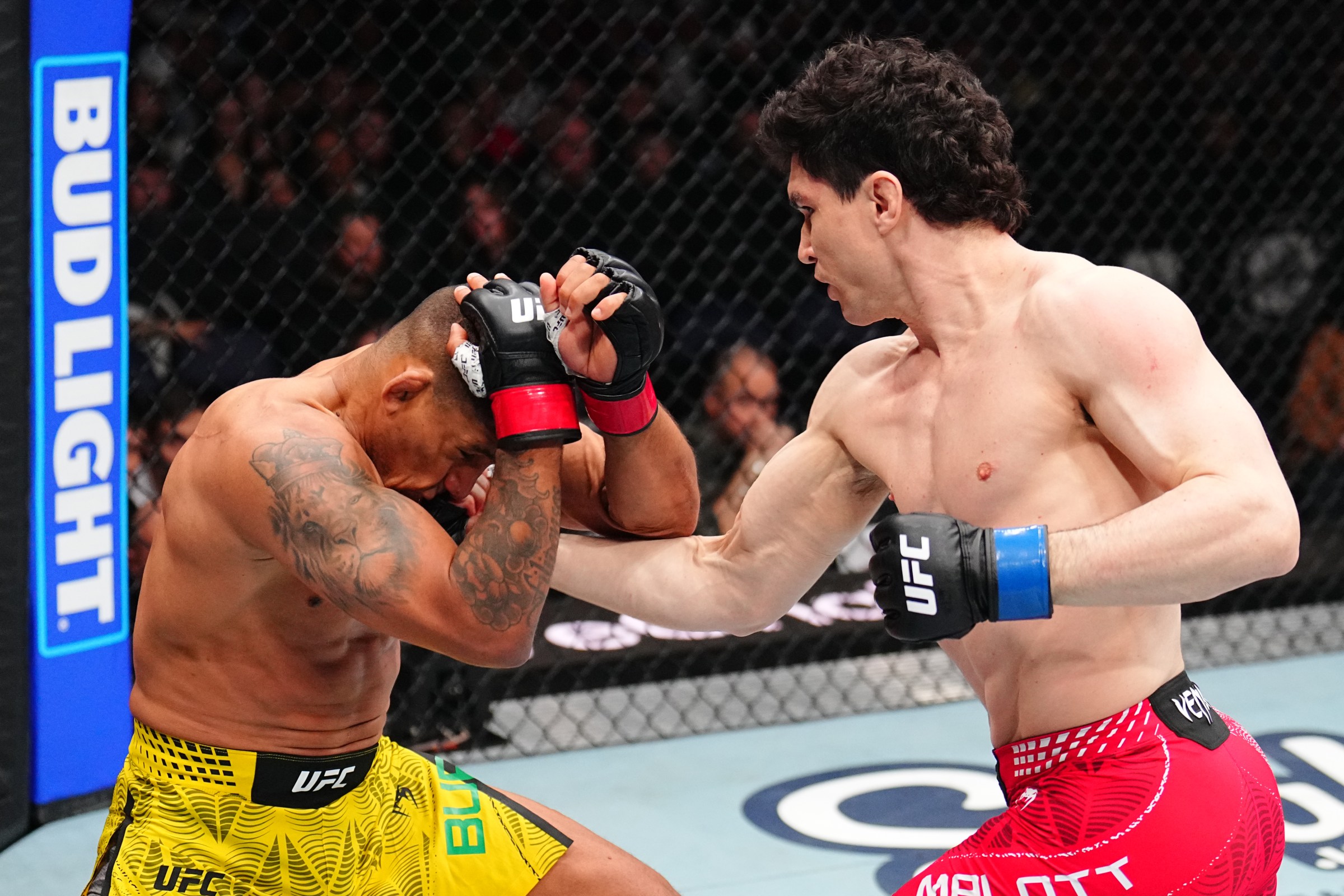 WINNIPEG, MANITOBA - APRIL 18: (R-L) Mike Malott punches Gilbert Burns of Brazil in a welterweight fight during the UFC Fight Night event at Canada Life Centre on April 18, 2026 in Winnipeg, Manitoba. (Photo by Chris Unger/Zuffa LLC)