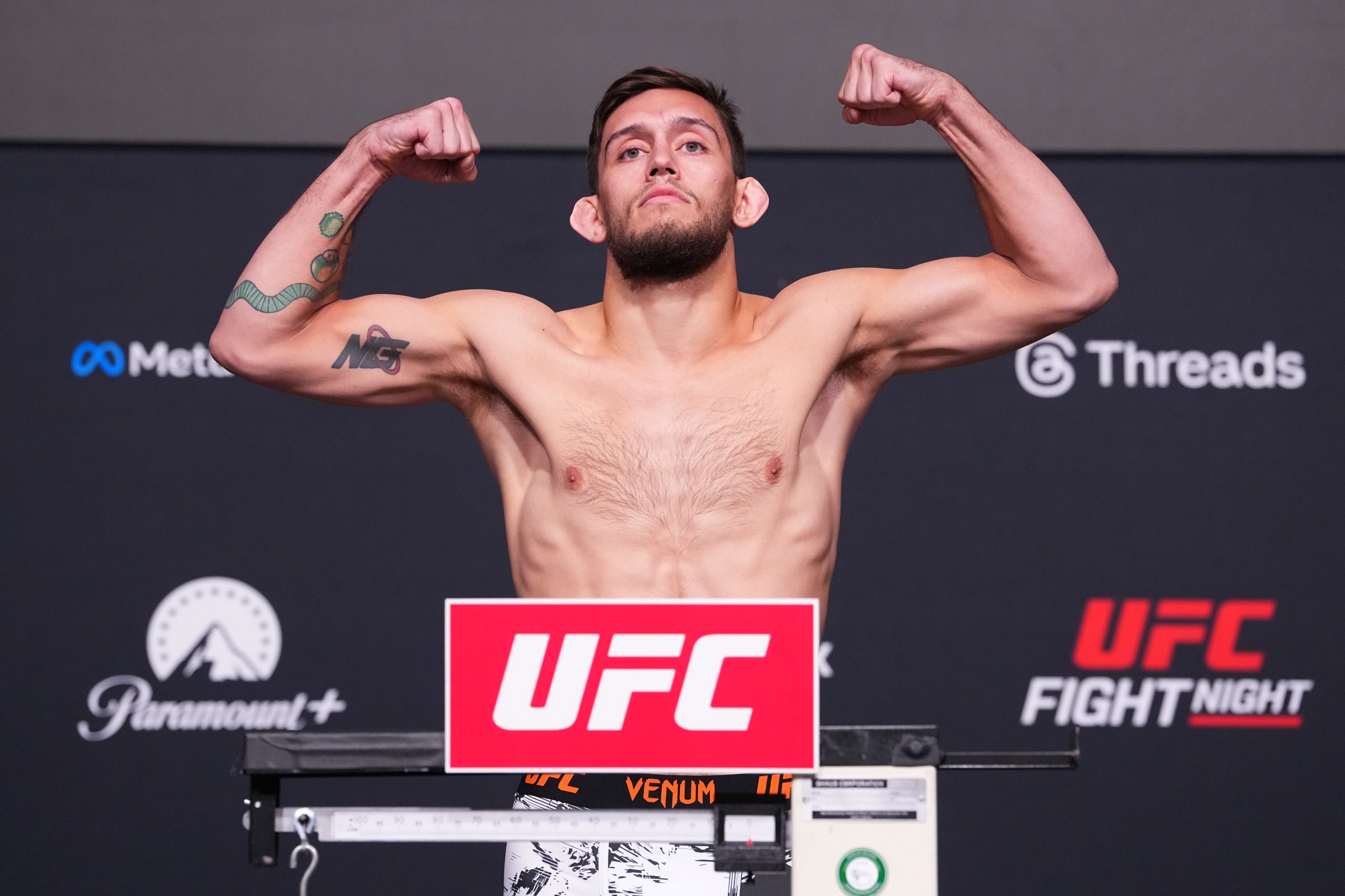 LAS VEGAS, NEVADA - APRIL 24: Lucas Brennan poses on the scale during the UFC weigh-in at Meta APEX on April 24, 2026 in Las Vegas, Nevada. (Photo by Jeff Bottari/Zuffa LLC)