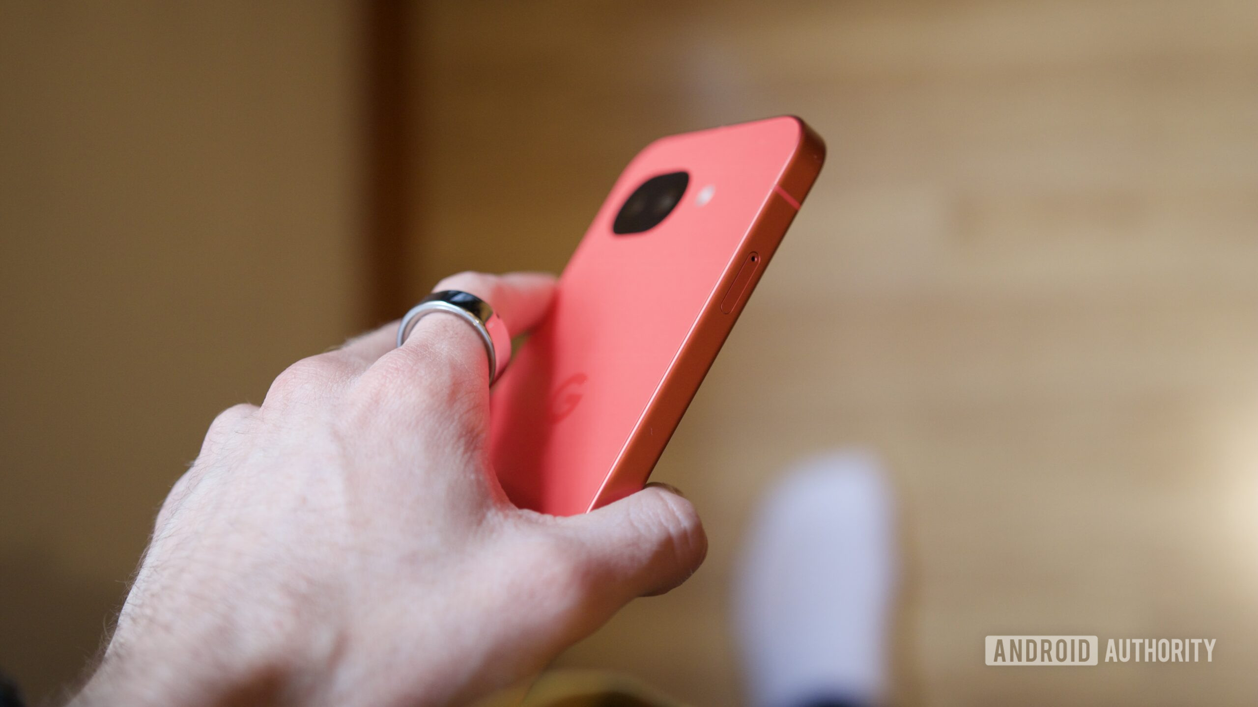 A side view of someone holding the Google Pixel 10a.