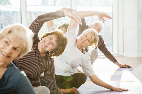 Group of active seniors exercise in yoga class. Group of active seniors exercise in yoga class.