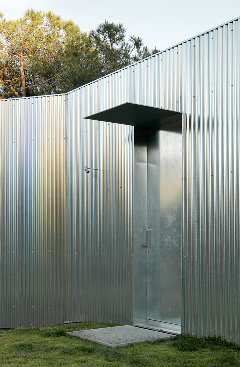 metallic house 144º rises on steel stilts above hillside near barcelona - 7