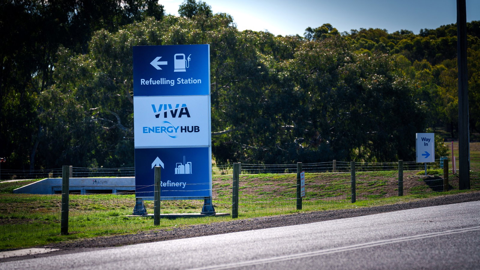 A sign on the side of the road reads "Refuelling station, Viva Energy Hub, Refinery'