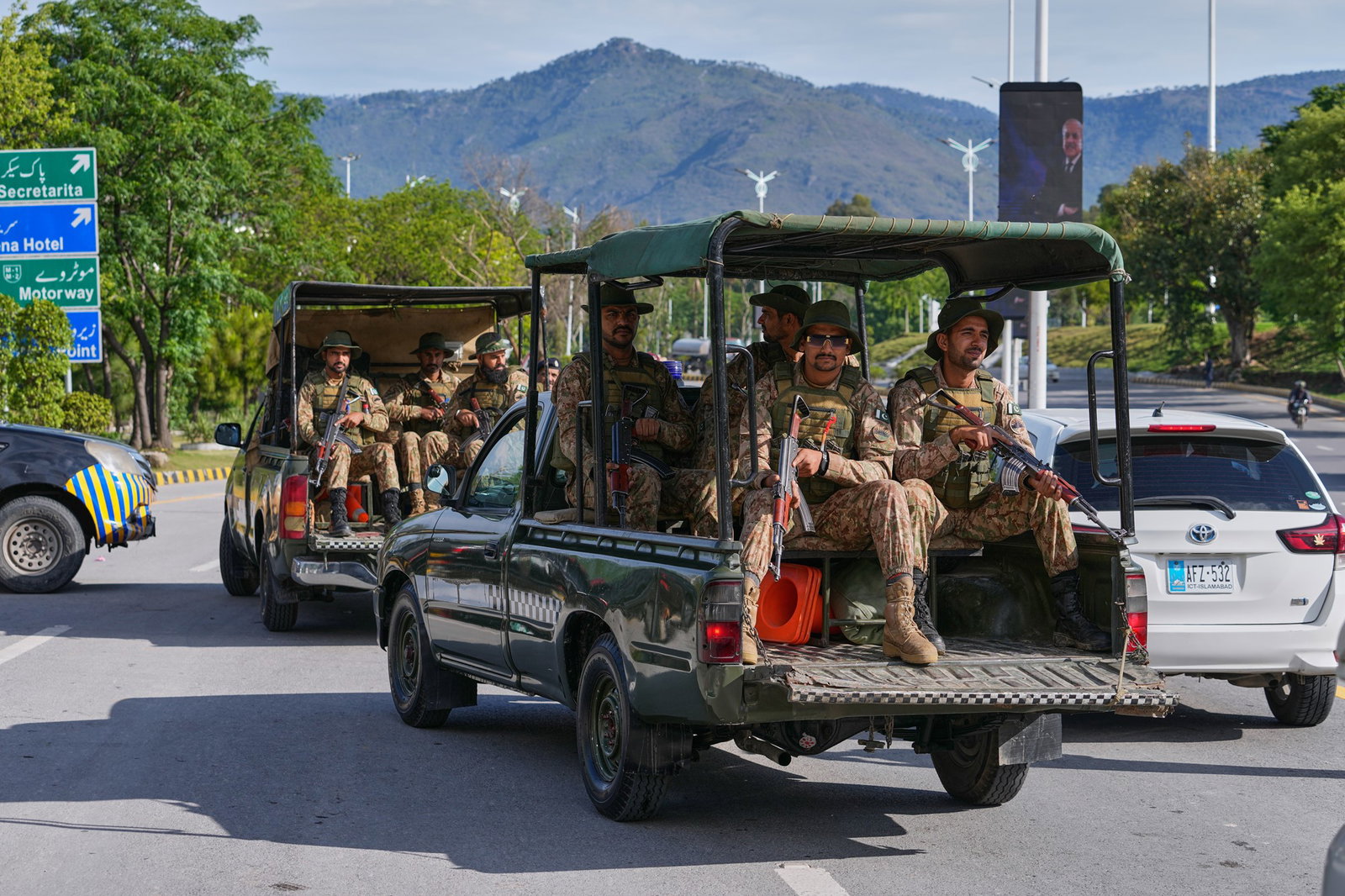 Army troops patrol to ensure security on the back of utes
