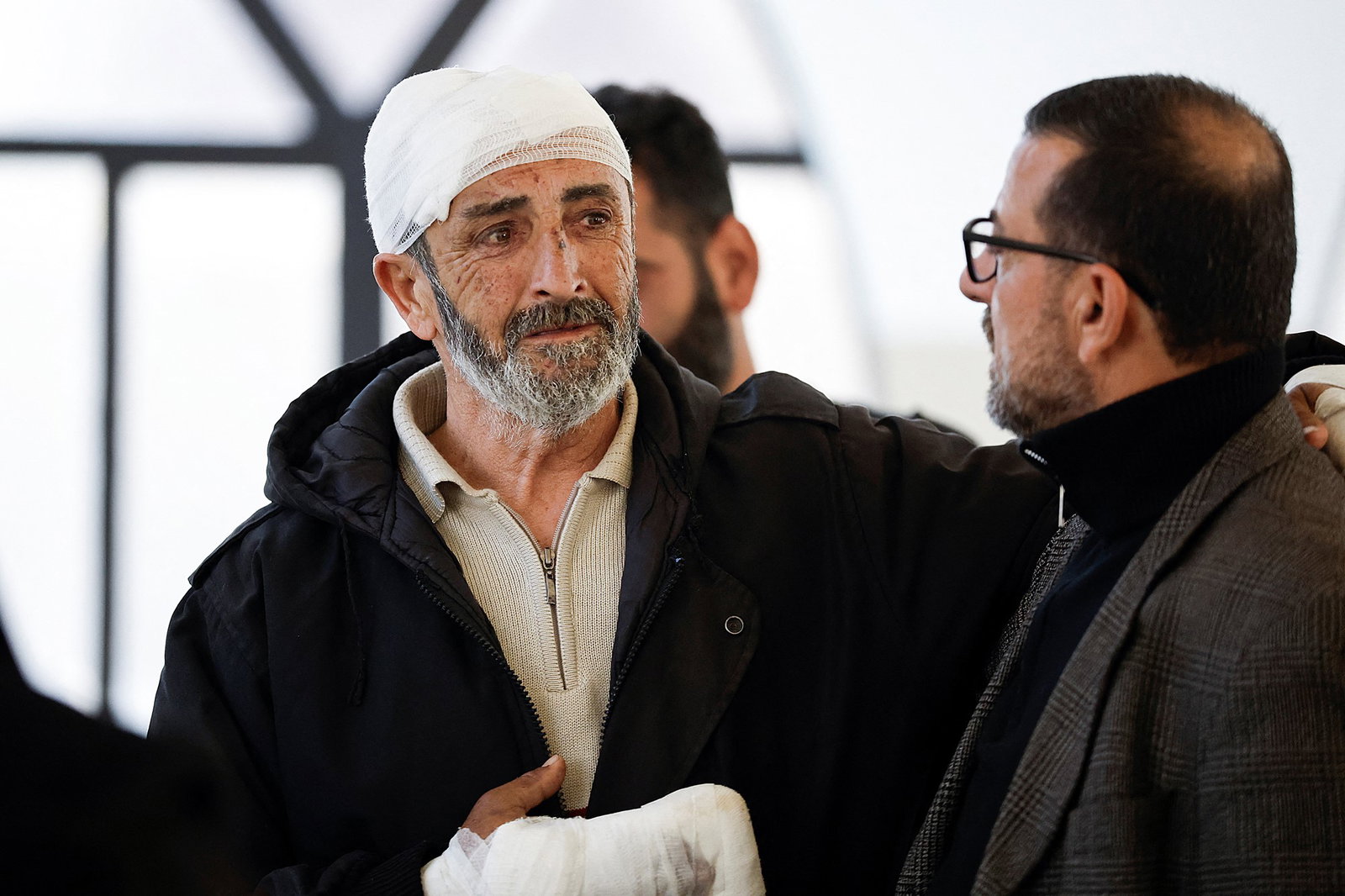 Nasser Hussein Saeed, 64, reacts as he arrives for the funeral service of four members of his family