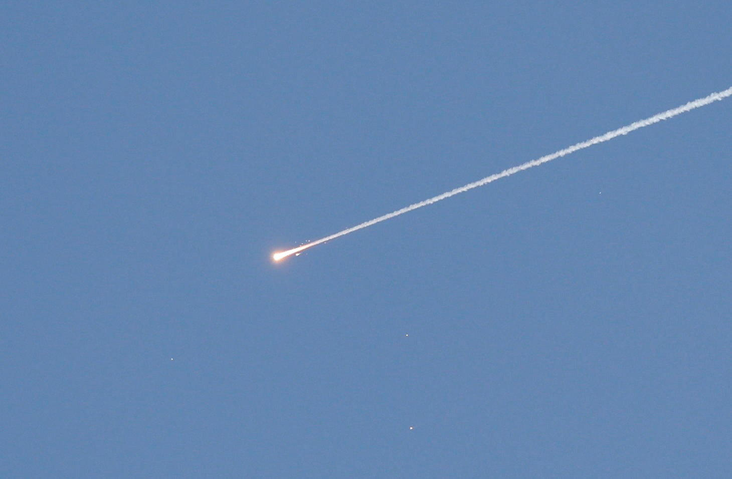 A projectile in the blue sky. 