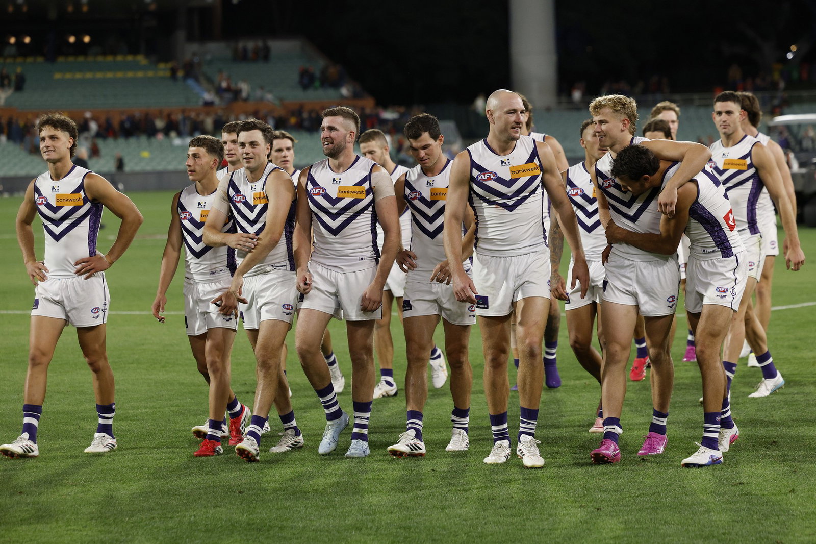 Dockers players walk off Adelaide Oval.