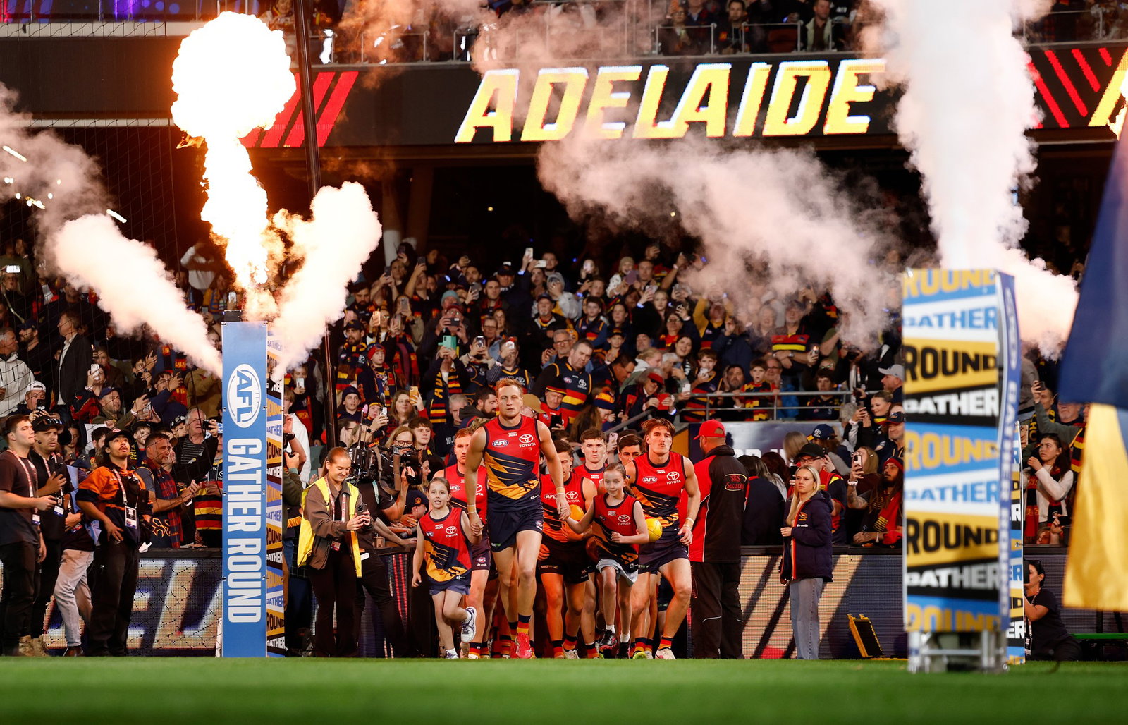The Crows run onto the field during the 2026 AFL Round 05 match between the Adelaide Crows and the Carlton Blues at Adelaide Oval on April 9, 2026 in Adelaide, Australia.