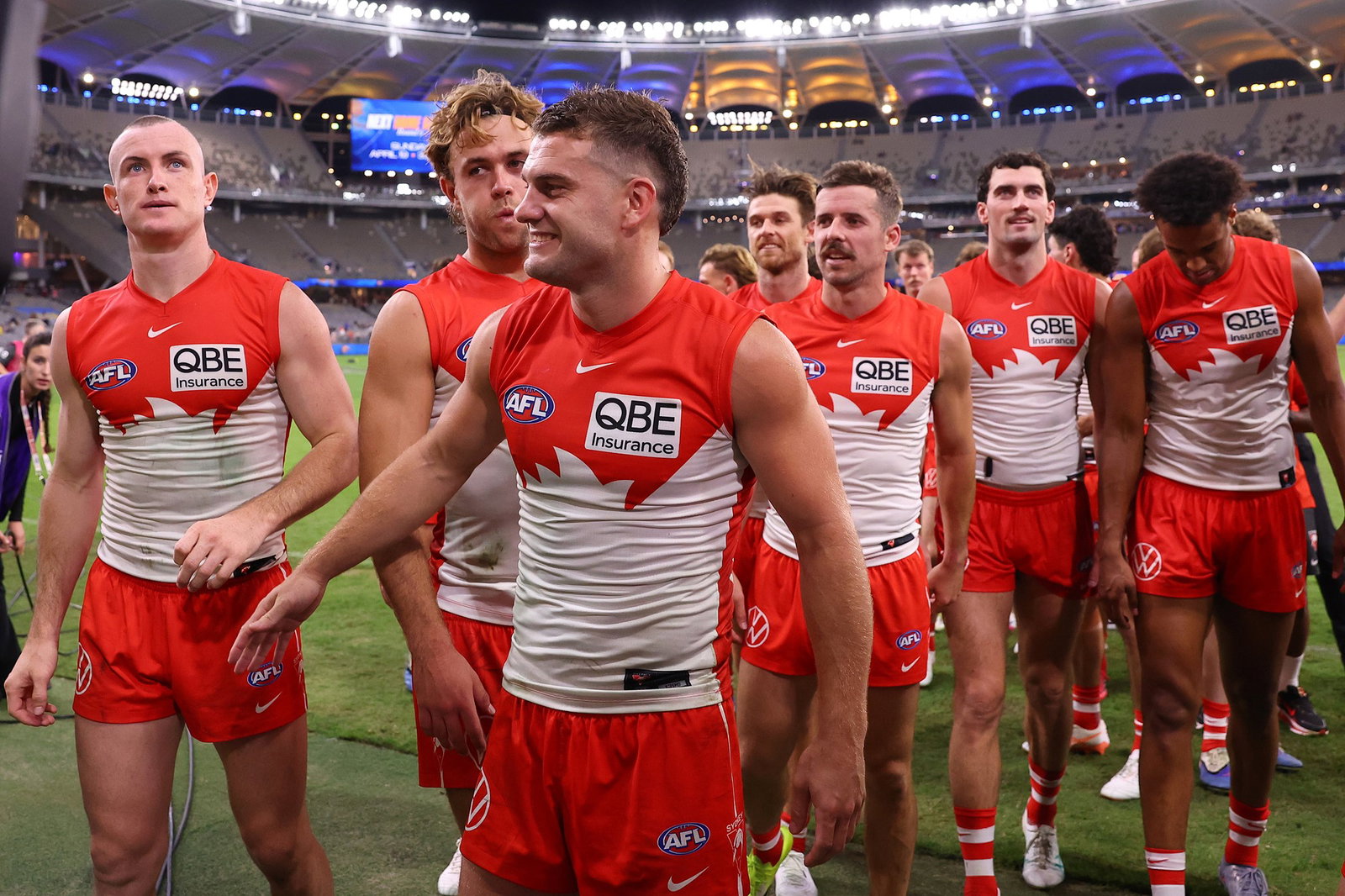 Tom Papley of the Swans leads the team from the field after playing his 200th game and winning the round four AFL match between West Coast Eagles and Sydney Swans at Perth Stadium, on April 04, 2026, in Perth, Australia.