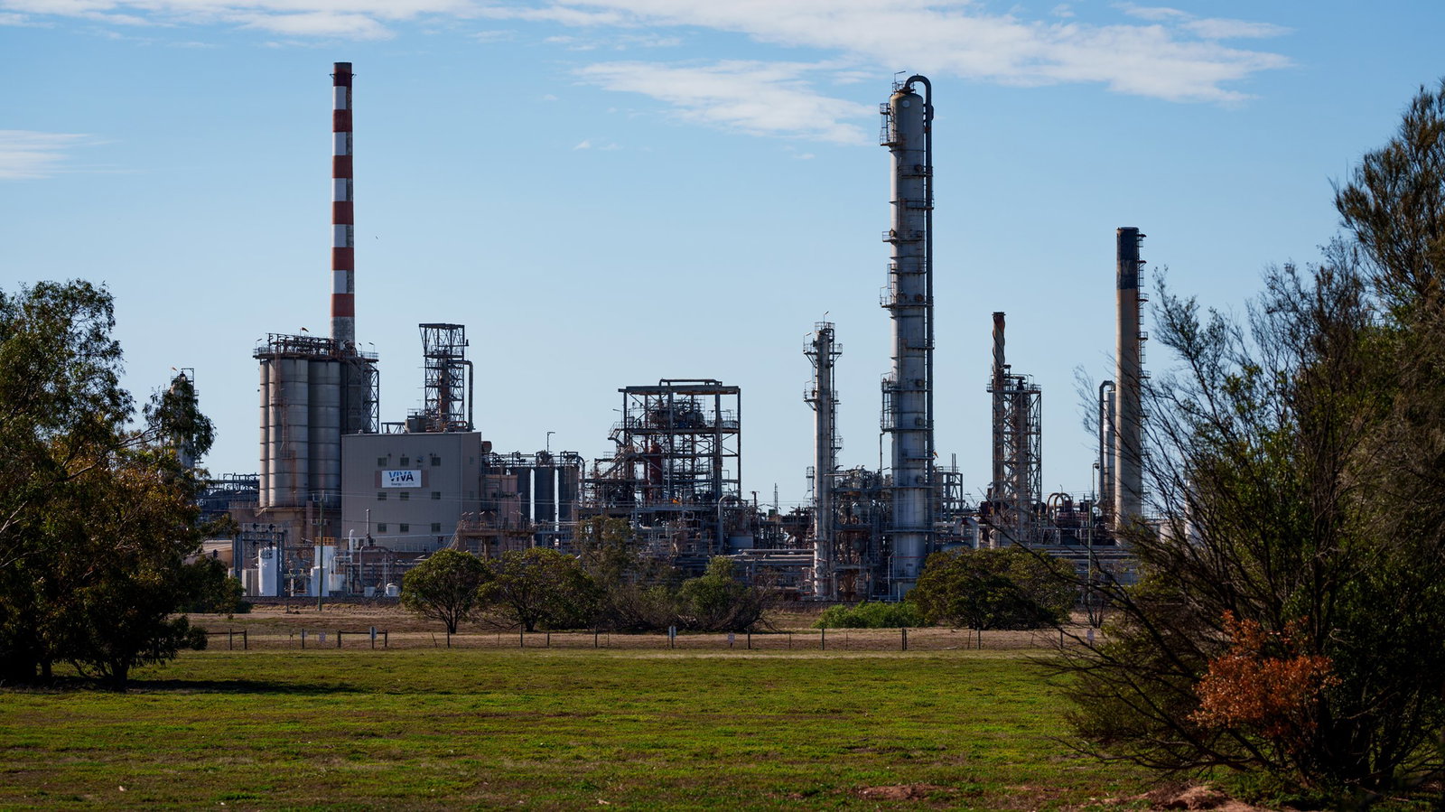 Viva's Energy refinery is seen from afar under blue skies