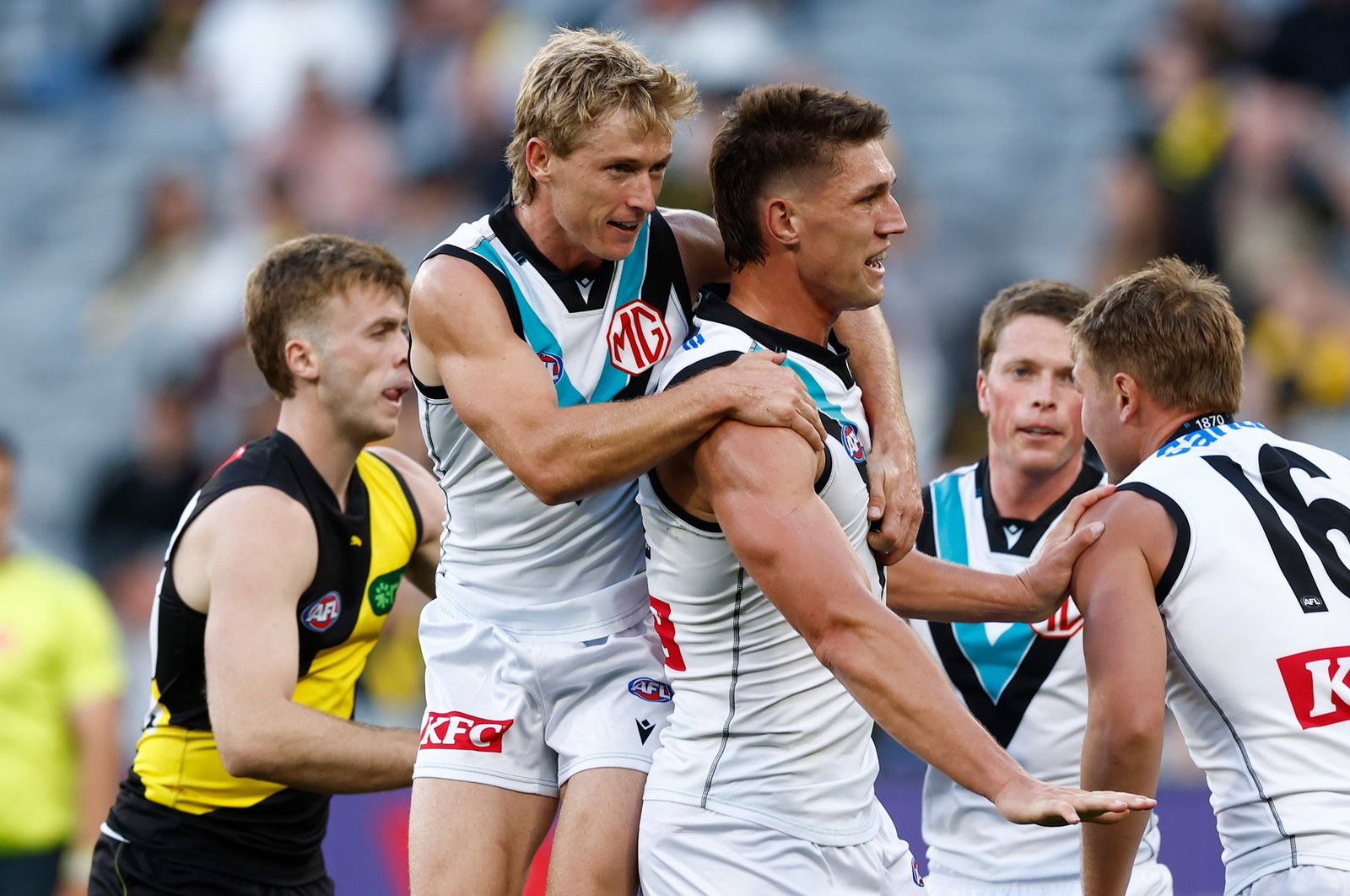 Joe Richards (left) and Jordon Sweet of the Power celebrate during the 2026 AFL Round 04 match between the Richmond Tigers and the Port Adelaide Power at the Melbourne Cricket Ground on April 4, 2026 in Melbourne, Australia.