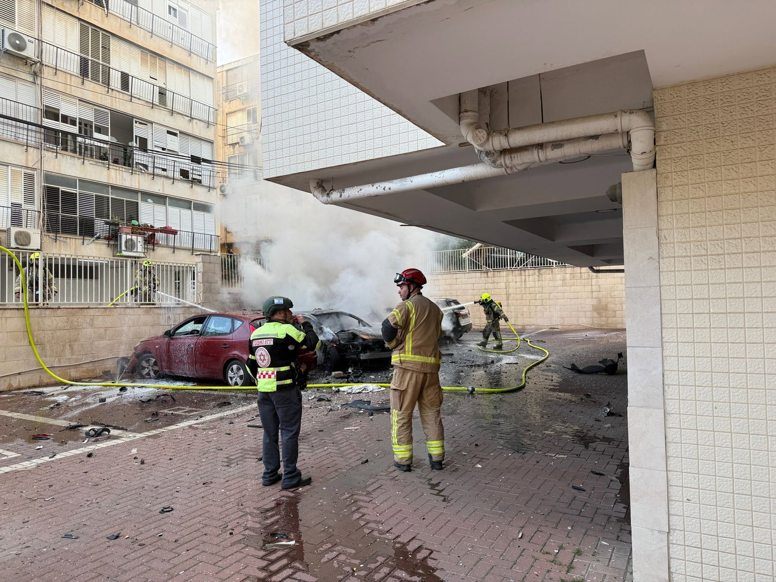 Emergency workers next to debis. 