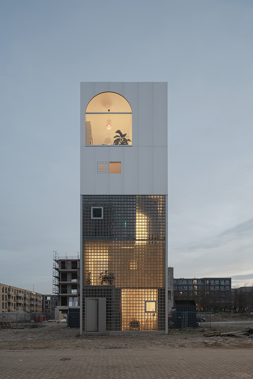 glass block facade wraps studioninedots’ playfully stacked box residence in amsterdam - 1