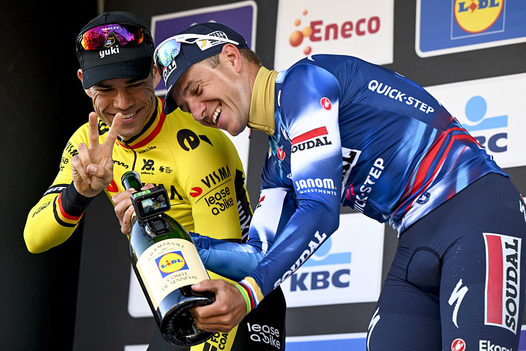 (L to R) Second placed Belgian Wout van Aert of Team Visma-Lease a Bike and first placed Belgian Remco Evenepoel of Soudal Quick-Step take a selfie on the podium after the men's 'Brabantse Pijl' one day cycling race, 162,5km from Huizingen, Beersel to Overijssel on April 18, 2025. (Photo by Tom Goyvaerts / Belga / AFP) / Belgium OUT