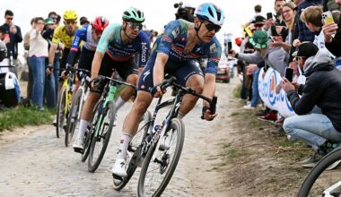Jasper Stuyven leads a chasing group around a dusty, cobbled corner during Paris-Roubaix 2026