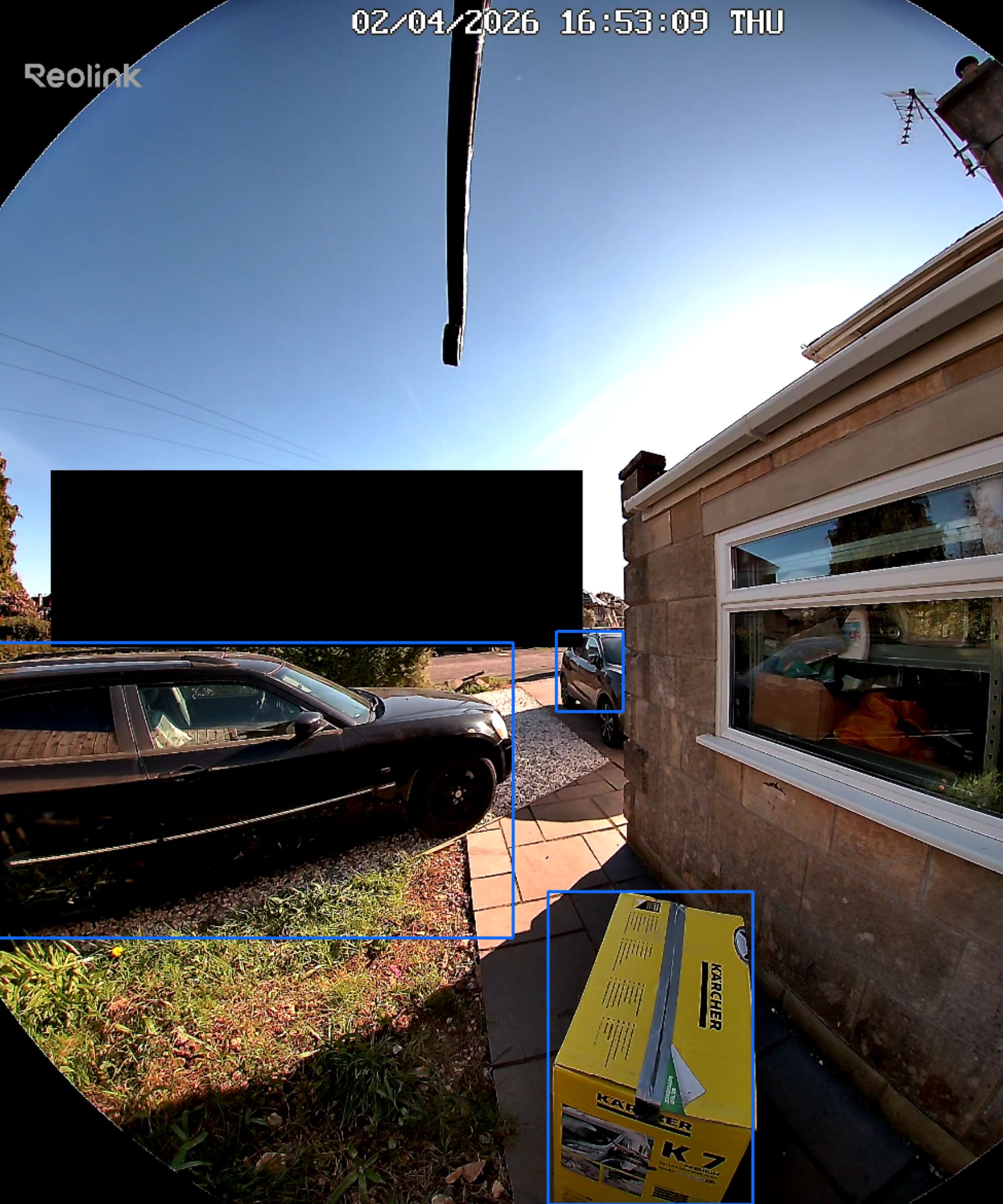Screenshot of Reolink app, showing Reolink video doorbell (battery) detecting package and car on drive on sunny day.