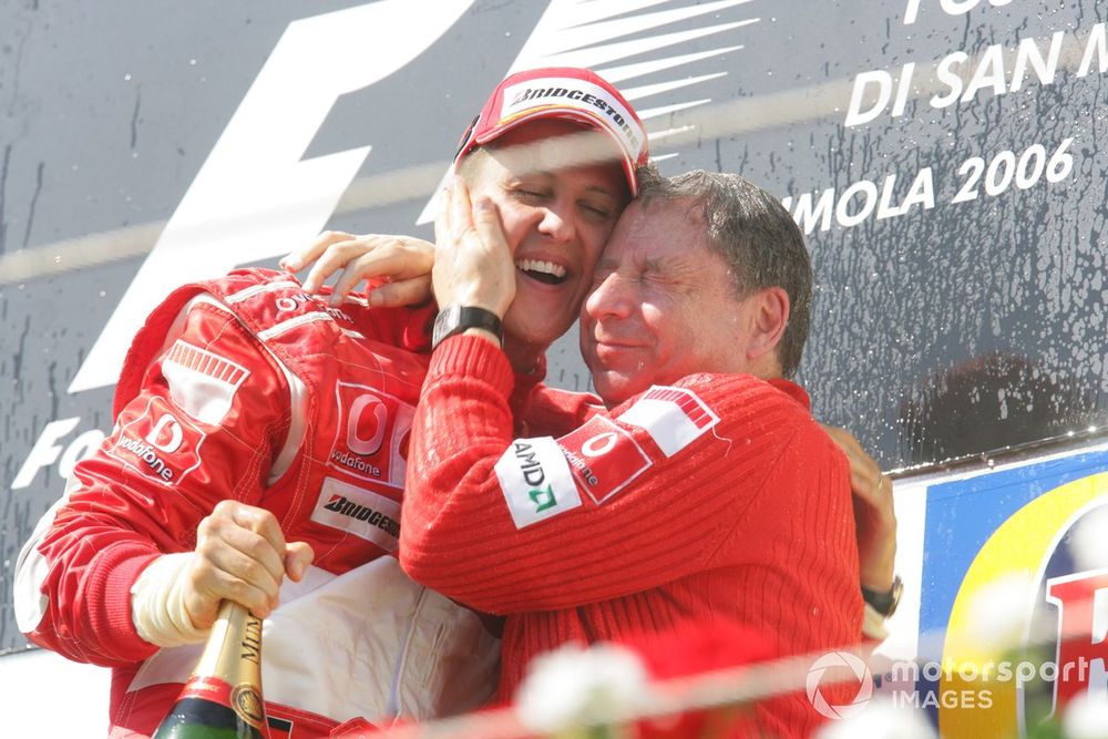 Michael Schumacher, Ferrari 248F1, 1st position, and Jean Todt, podium