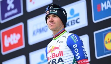 Evenepoel pictured on the podium wearing his team jersey and winter hat