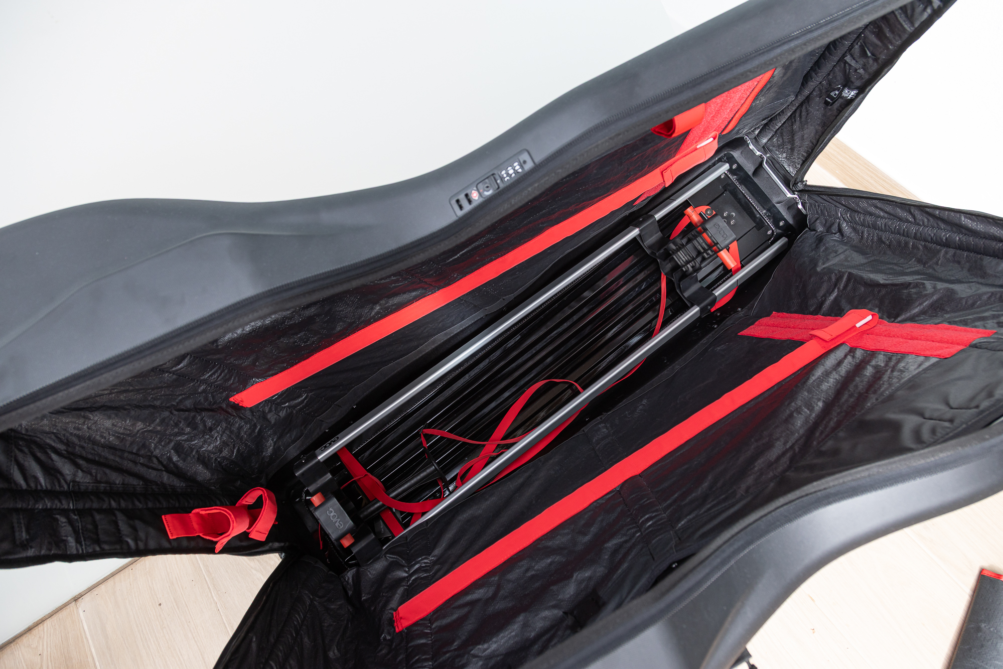 A view inside the Road Bike Bag Pro showing the red straps and metal frame